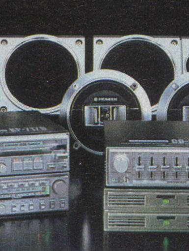 Vintage Pioneer car audio system components against dark background. Includes speakers and equalizers. Retro electronics.