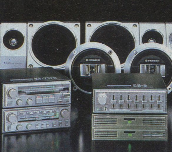 Vintage Pioneer car audio system components against dark background. Includes speakers and equalizers. Retro electronics.