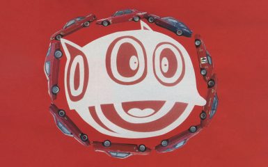 Smiling white cartoon face surrounded by red cars on a bright red background. Text ラリー translates to rally.
