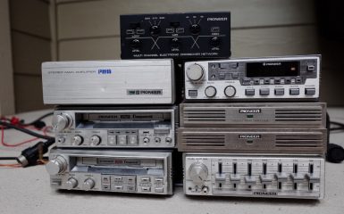 Vintage Pioneer audio equipment including a stereo main amplifier, component systems, and an electronic crossover network.
