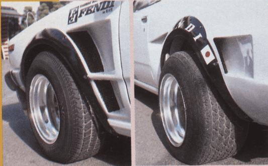 Close-up of a car's wide rear fenders and tires showcasing customized design and details with decals.
